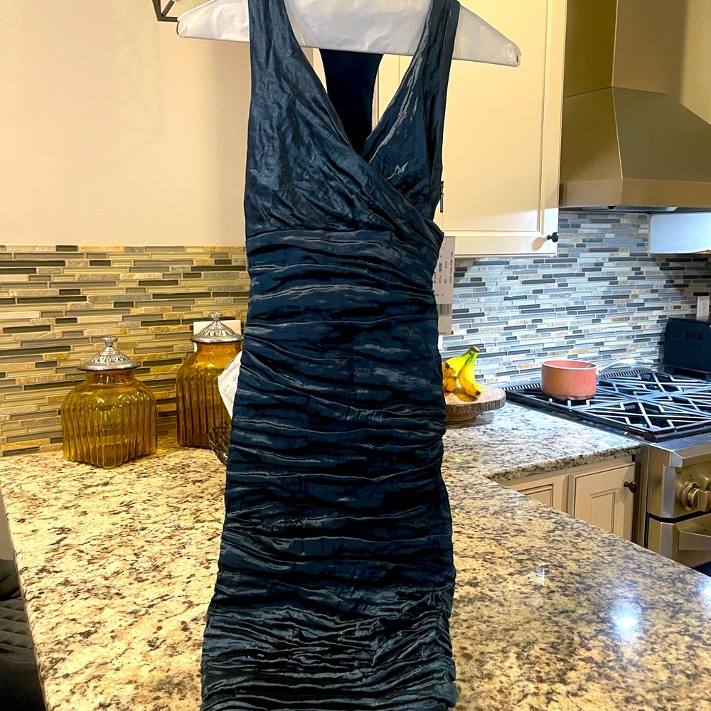 Beautiful Teal Blue cocktail dress. Stretch fabric and side zipper.  Size 0